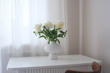 Beautiful and Elegant White Flowers Arranged Tastefully in a Modern Vase on a Minimalist Table