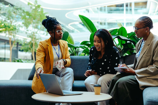 Accounting professionals discuss finance strategies in a modern office setting