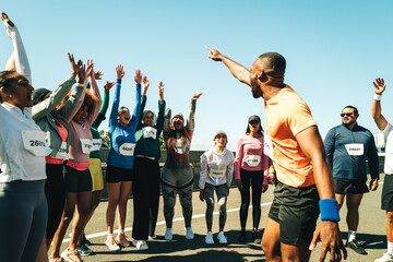 Group of runners cheering and celebrating at a community event