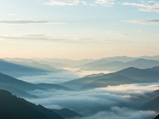 Fototapeta premium Serene sunrise over misty mountain ranges