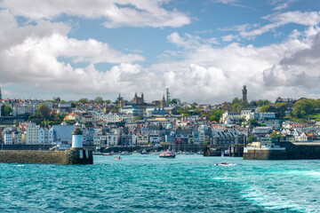 View of the harbor, the lighthouse and the town of St Peter Port in Guernsey, Channel Islands