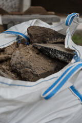 The pieces of the paved road are stacked in a dedicated bag