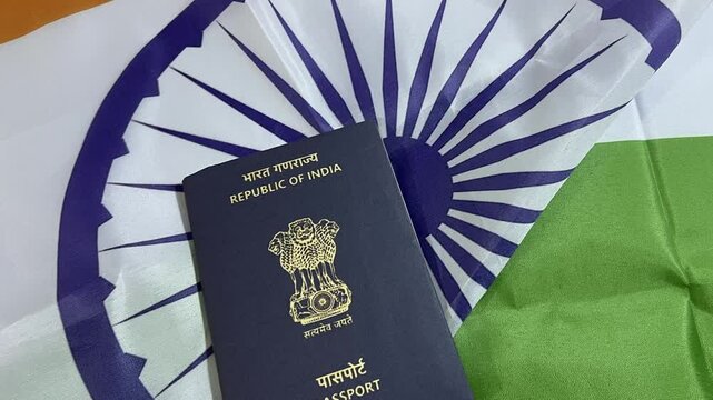 Republic of India passport with flag in the backdrop, 4k footage close up. Indian citizenship, nationality