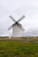 white wind mill in rural landscape