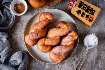 Korean donuts on a grey breakfast plate. Sweet donuts for dessert. View from above. Close-up