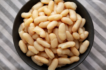 Organic Cannellini Beans in a Bowl, top view.