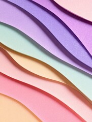 Colorful textured paper layers in soft pastel shades create a vibrant background for design