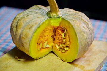 Close-up view of pumpkin on a chopping board