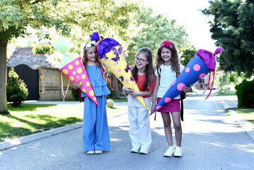 Children with School cone in their hands. First day of school