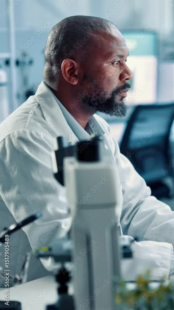 Aufkleber black man, scientist and forensic research with computer for biology experiment or results at lab. m