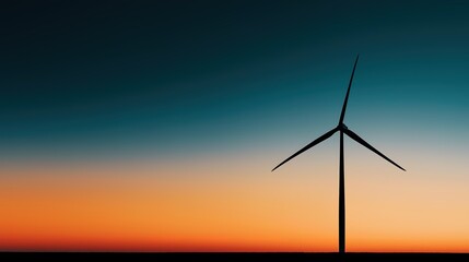 Fototapeta premium Wind turbine against sunset sky, symbolizing clean energy and sustainable future