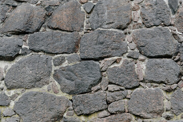 grey stone wall, decorative wall made of large stones, abstract pattern, background