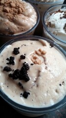 Cups of Dessert with Crumble Toppings in Bowls Close Up