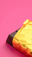 Golden Wrapped Dark Chocolate Bliss Indulgence Treats Pink Backdrop Delicious Sweet Temptation Chocolate Bar Food