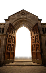 Grand Catholic Church Entrance at Night with Open Carved Doors