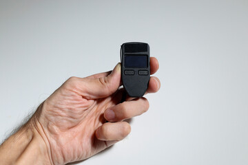 Cold wallet device in hand, used for safe offline cryptocurrency storage
