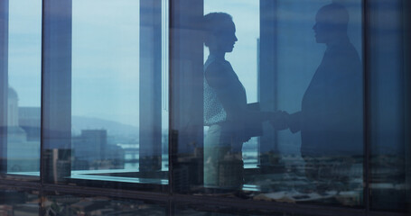 Window, business people and handshake for deal, agreement or investment for company integration. Buyer, meeting and shaking hands in office for trust, partnership acquisition and thank you for merger