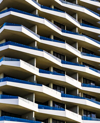 A cropped image of the balconies of a modern apartment block.