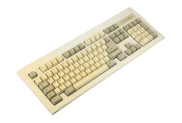 Vintage computer keyboard from the 1990s isolated on white background.