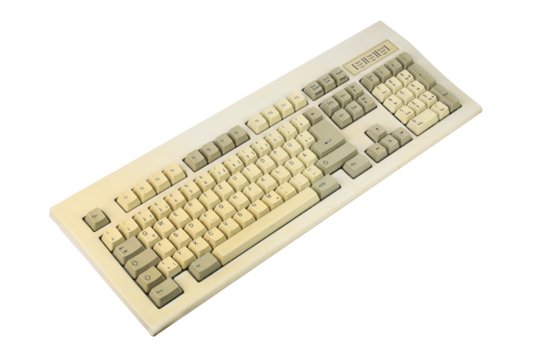 Vintage computer keyboard from the 1990s isolated on white background.