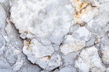Cracked, light gray and white stone surface