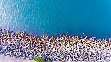 Aerial View of a Sea Barrier with blue waters