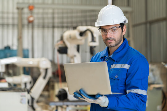 Robotic arm, Automatic robotic arm welding. Robotic manufacturing industry. Engineer setup, install, maintain, repair mechanism of operation of robotic arm in workshop