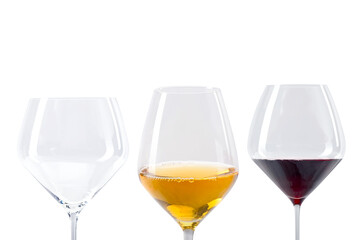 Three wine glasses side by side on a transparent background—one empty, one filled with white wine, and one with red wine, captured in a clean studio setup

