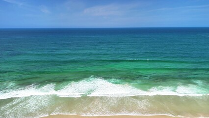 Experience Serene Coastal Views Featuring Turquoise Waters and Gentle, Soothing Waves