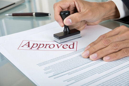 Approving a document with an approved stamp on a business transaction