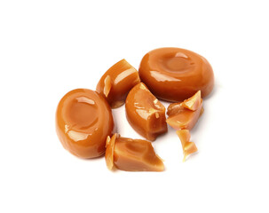 Tasty sweet caramel candies isolated on white