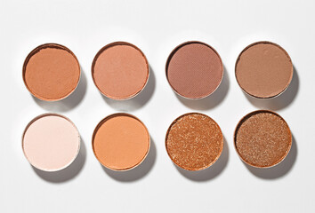 Beautiful eyeshadow refill pans on white background, flat lay