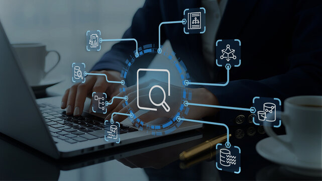 Marketing analysis of customer behavior data. Graphs of statistical web analytics and predictive financial analytics on dashboard. Analyst using laptop computer to analyze data.