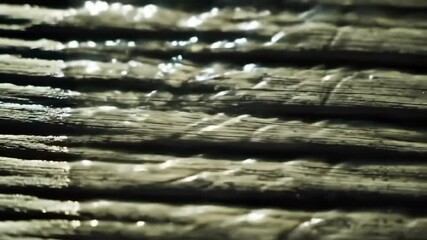 Close-up view of layered wood with water droplets - Powered by Adobe