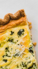 A fresh quiche slice cut and captured in detail on a bright white surface – quiche wallpaper – bakery wallpaper – quiche image


