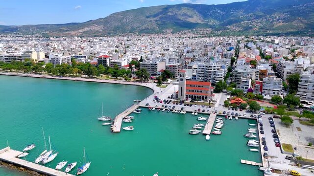 Panoramic aerial view of the cityscape of Volos, Magnesia, Greece, with Agios Konstantinos church and yacht marina