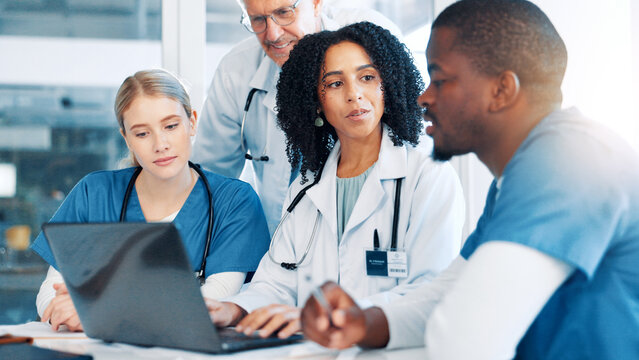 Doctors, nurses and meeting with laptop at hospital, review and strategy with report for virus in boardroom. People, medical staff and team with feedback, talking and planning for solution at clinic