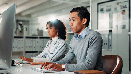 Office, coworking and businessman with computer for typing, auditing and research for information. Employees, male person and accountant with digital for finance report, online review and tax website