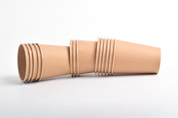 Stack of the brown disposable cups isolated on white background.