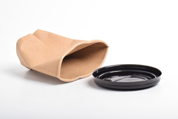 Crumbled brown paper coffee cup isolated on white background