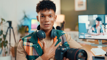 Influencer, content creator and portrait of man with camera for tech review, feedback or vlog. Live streaming, social media and person talking for recording video, podcast and opinion to audience
