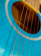 Obraz premium Close-Up of Blue Acoustic Guitar Strings