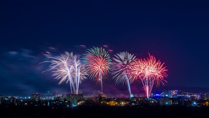 Festive fireworks display over cityscape at night seasonal holiday backgrounds