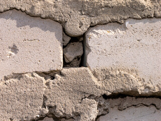 Fototapeta premium A wall made of bricks with a hole in it