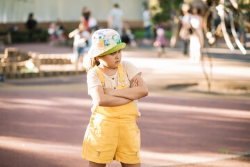 Upset lonely bullied little kid girl looking away feels abandoned abused, sad alone child in...
