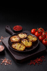 Food, potatoes cut in halves or slices grilled. Cooked baked potatoes