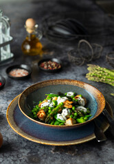 Delicious chicken salad with green peas and asparagus seasoned with yogurt sauce