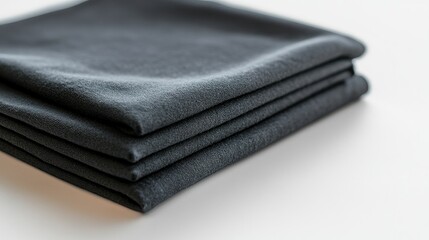 Stacked dark gray fabric napkins