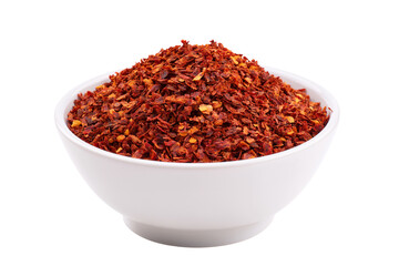 bowl of vibrant red chili flakes isolated on white background