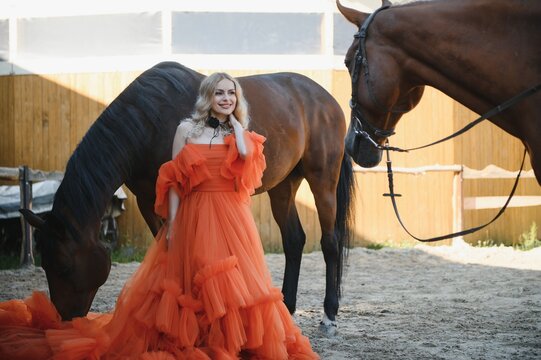 young woman in a dress with a horse